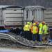 A portion of a guardrail is seen mangled and covered in debris as crews stand by on south U.S. 23 north of Six Mile Road in Northfield Township on Monday, March 11, 2013. Melanie Maxwell I AnnArbor.com